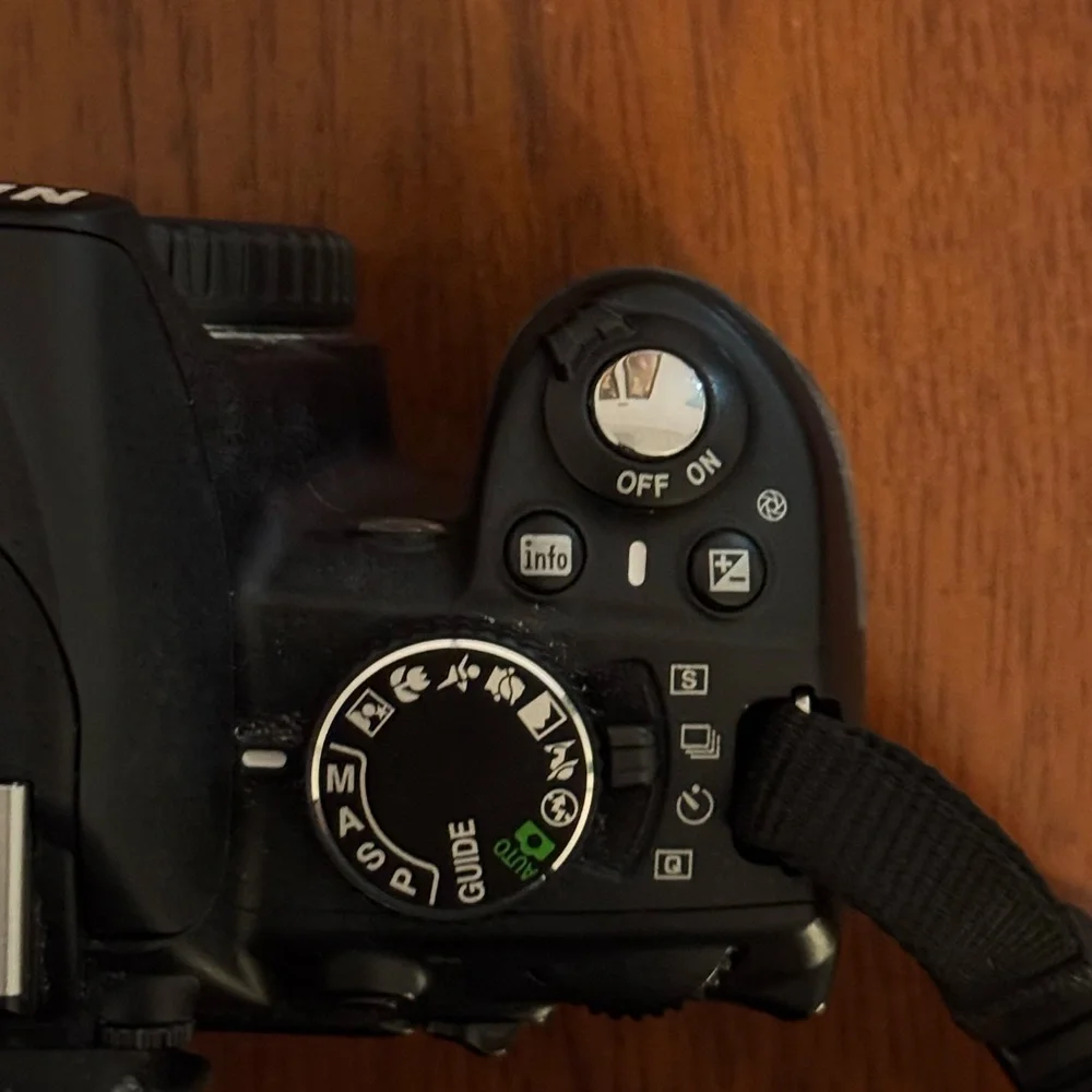 Nikon D3100 with 18-55mm lens + 55-200mm lens